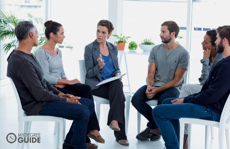 psychologist conducting a group therapy session