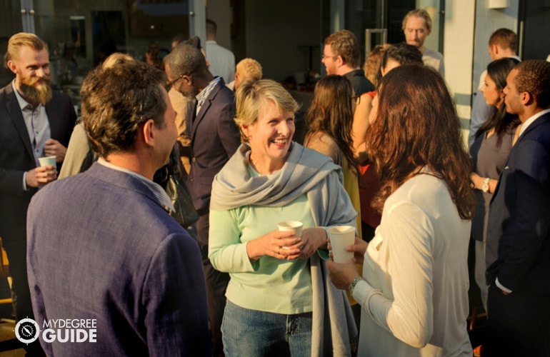 group of professionals mingling during a conference