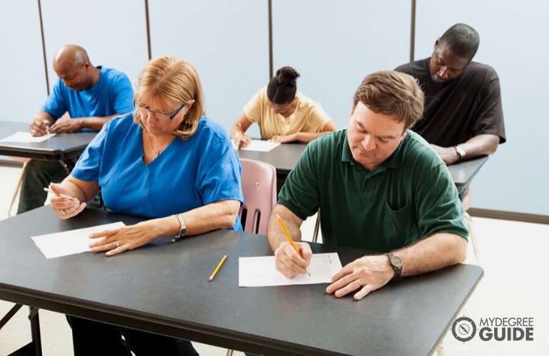 people taking an exam in a testing center