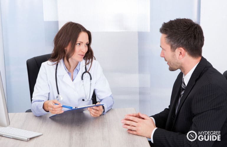healthcare manager having a meeting with a doctor