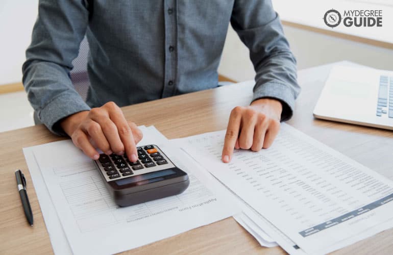 accountant working with a calculator