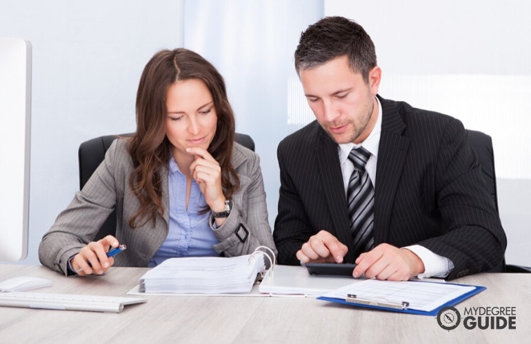 two accountants sitting at desk