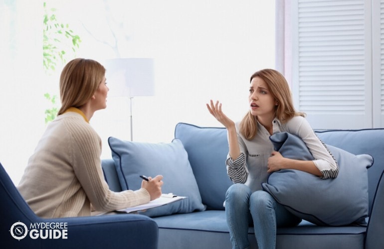psychologist listening to a patient with anxiety