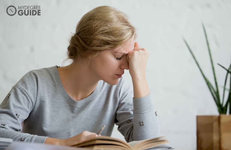 female student having a difficult time studying