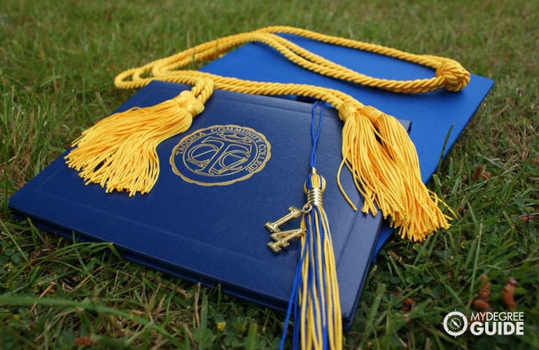 College diploma with honors cords