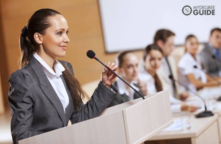 female manager speaking in public during a conference