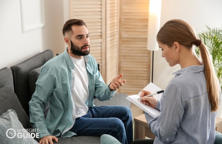 counselor listening to patient during counseling session
