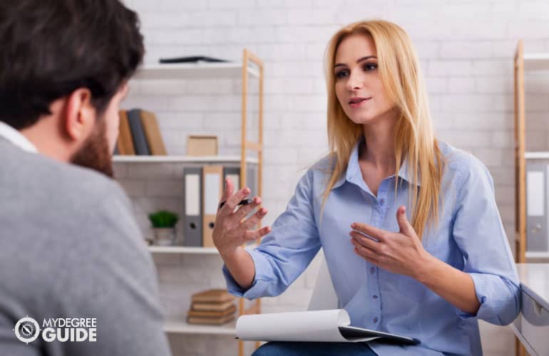 psychologist talking to a client in her office