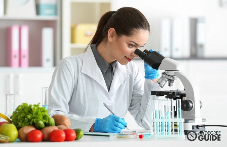 food scientist examining vegetables in a laboratory