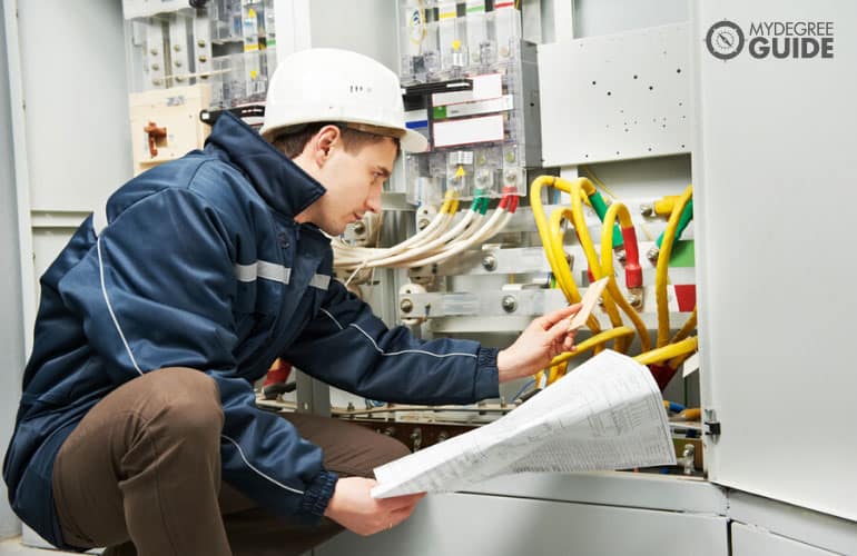 Electrical Engineer inspecting cable connection 