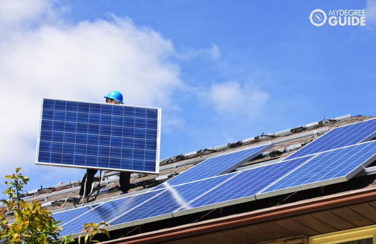 environmental engineer installing solar roof panels