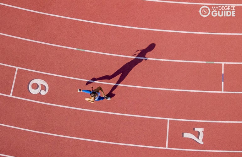 woman running in race track