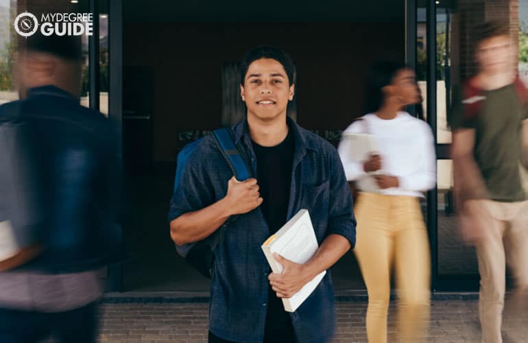 male student in a university with motion blur background