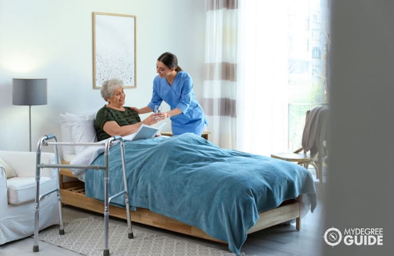 nurse assisting a patient in a nursing home