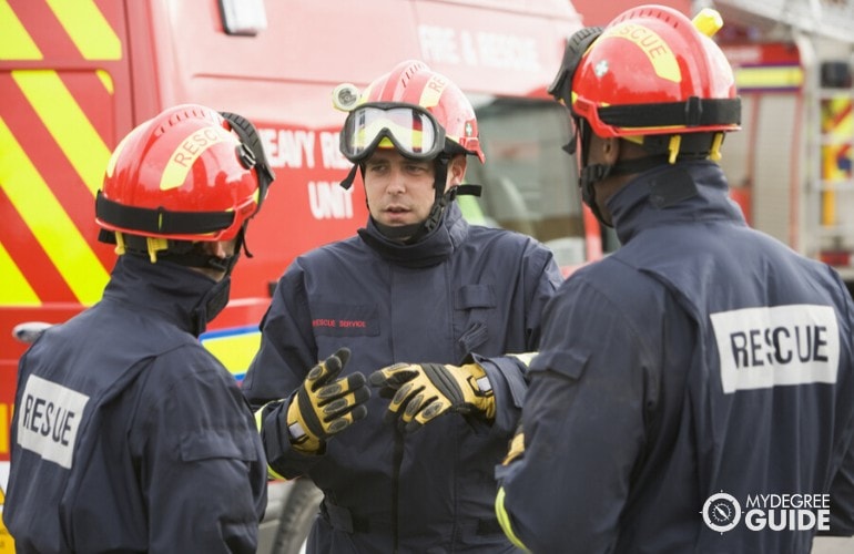 firefighter giving instructions to colleagues