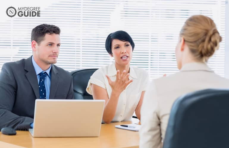 human resource managers interviewing an applicant