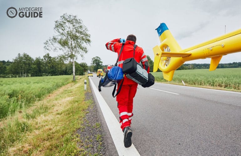 doctor running to help victims of a traffic accident