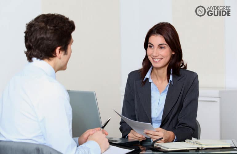 human resource manager interviewing a job applicant in an office
