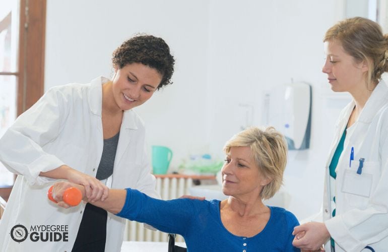 Two Occupational Therapists in a session with patient