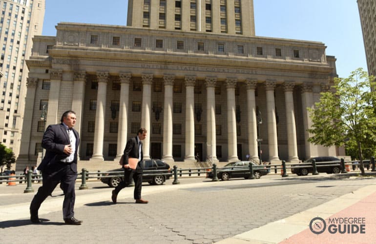 court clerks walking near a courthouse