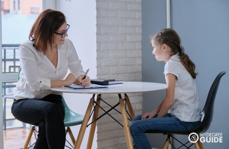 social worker interviewing a child