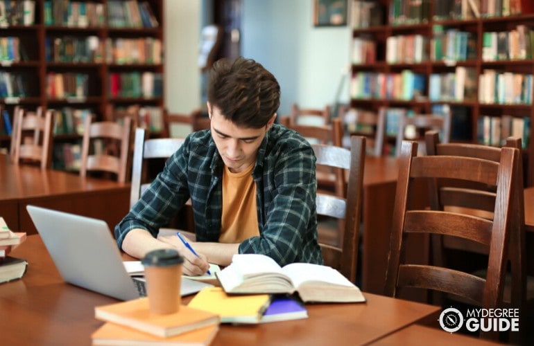 Mechanical Engineering student studying in a library