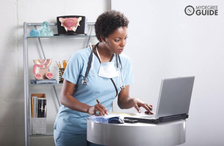 medical assistant working on her laptop