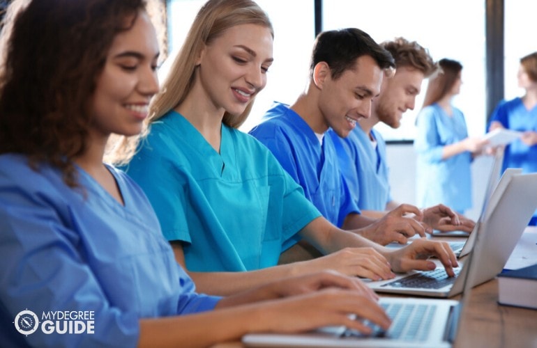 nurses studying on their laptop