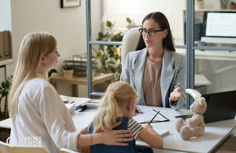 social worker interviewing a mom and child