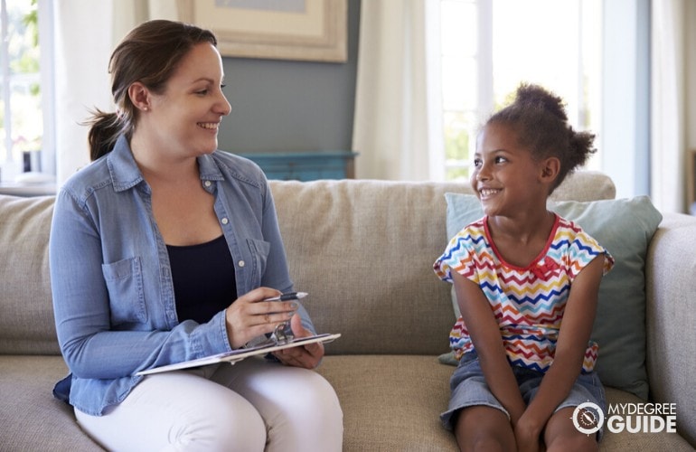 child psychologist interviewing a child in her home