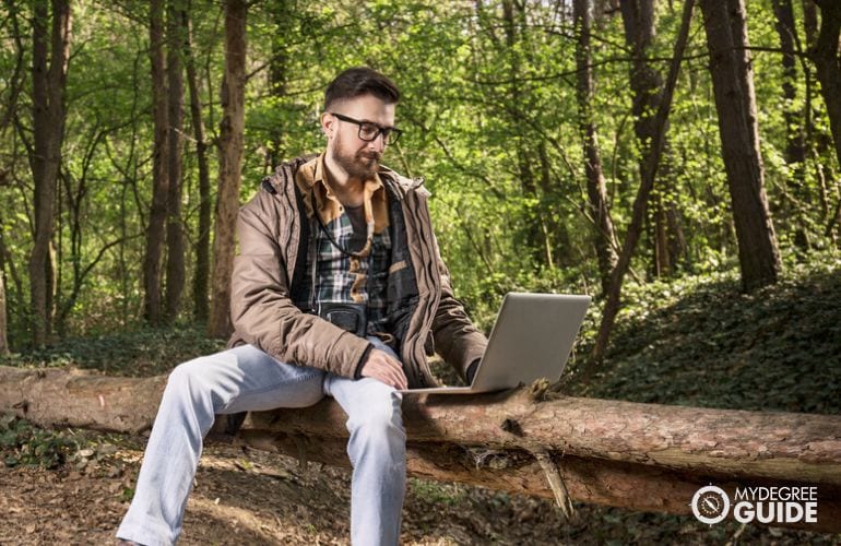 Man pursuing his PhD in Environmental Management Degree Online