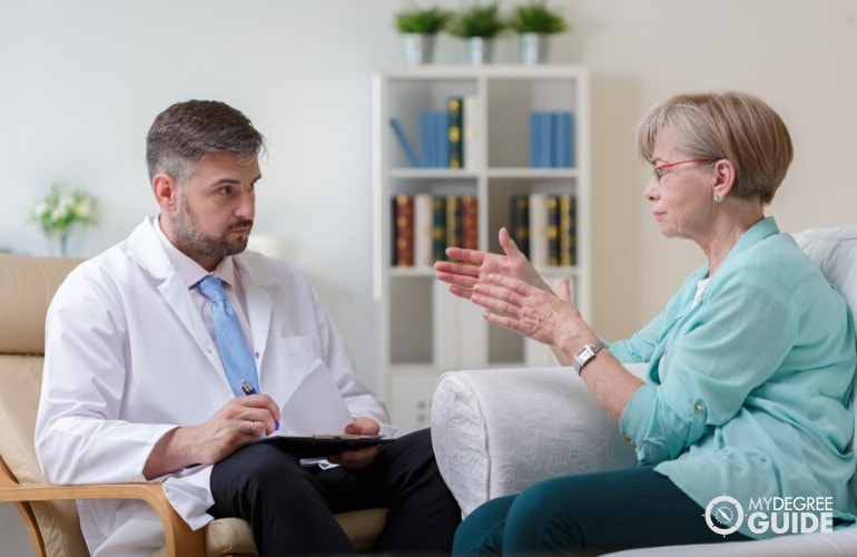 psychologist listening to an elderly patient