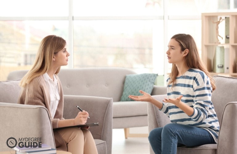 psychologist listening to her patient during counseling