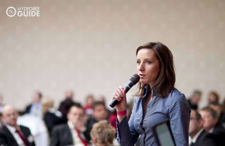 public administrator speaking during a conference
