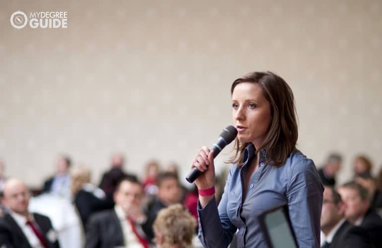 female manager speaking during a conference