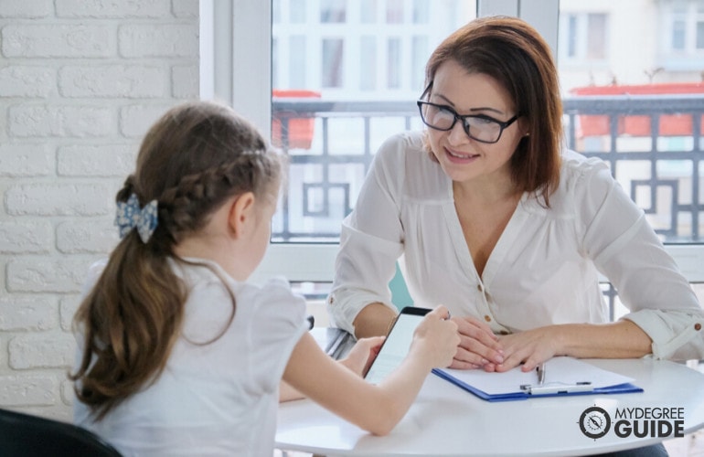 Social worker interviewing a child