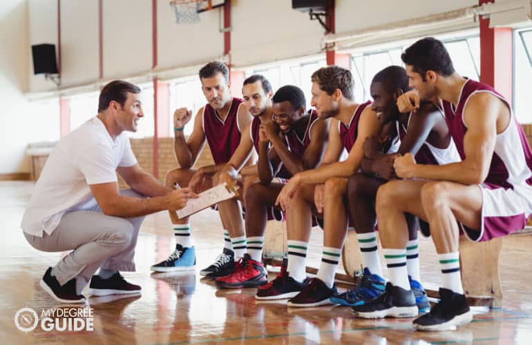 basketball coach talking to his team 