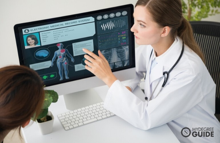 doctor showing medical records of her patient