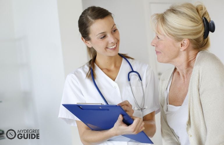 medical assistant taking care of a patient